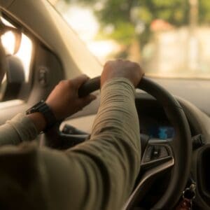 man driving car