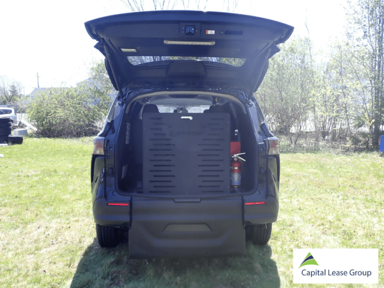 BraunAbility Simple Stow ramp folded upright inside the rear of a Toyota Sienna wheelchair van