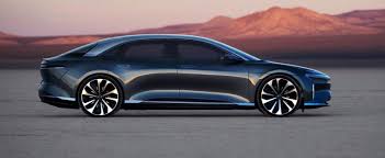 product image of black electric car parked infront of mountains at sunset